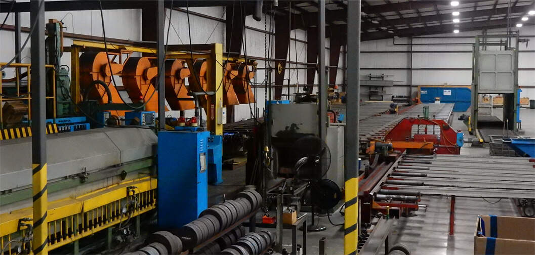 Interior of aluminum extrusion manufacturing facility in Jackson, Wisconsin with aluminum extruders and billets